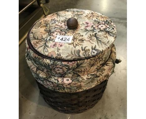 A wicker tapestry sewing box 