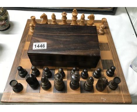 Vintage box wood chess set in hardwood box with an inlaid chess board.
