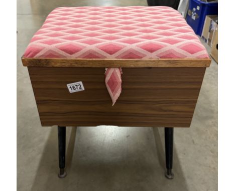 A vintage sewing box/stool and contents