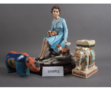 A Capodimonte model of HM The Queen with two corgis, signed Conti, on wooden base, 13 1/2" high (left index finger broken), t