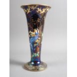 A Wedgwood "Fairyland" lustre trumpet vase, decorated two fairies, birds and imps, incised number