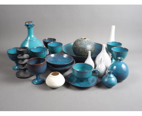 Annette Fuchs: a collection of turquoise glazed studio pottery bowls and goblets, three studio pottery sprinkler bottles and 