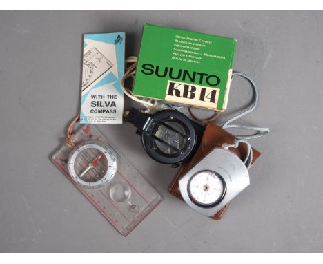 An N9 prismatic military compass with mother-of-pearl compass card, a Sunto KB14 compass, in leather case, and a Silva compas