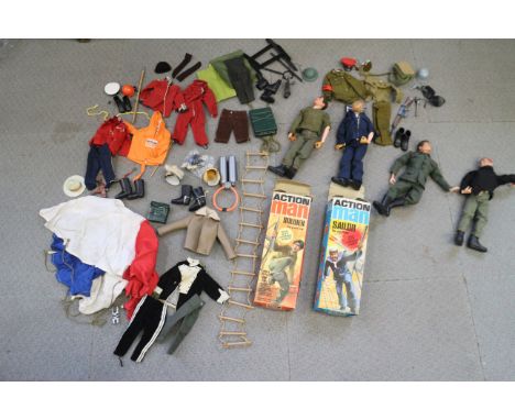 Two boxed Action Man figures, two unboxed, and a collection of accessories and uniforms