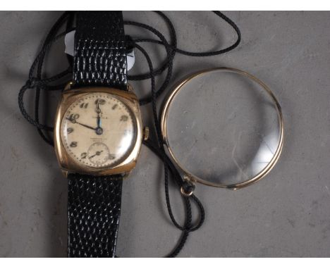 A gentleman's 1930s Omega wristwatch, in Dennison case and leather strap, and a yellow metal framed monocle 