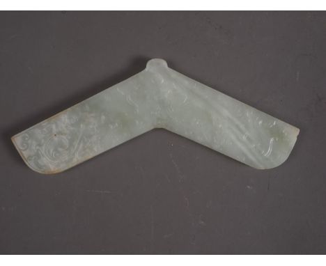 A Chinese pale celadon jade angular pendant, decorated two dragons, 6 3/4" wide Condition: One very small chip to lower insid