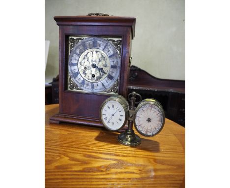 A mahogany cased bracket clock with brass dial and silvered chapter ring, and a brass cased desktop clock/barometer (as found