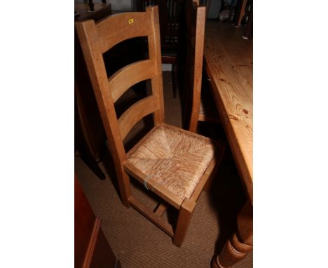 A set of eight ladder back dining chairs with rush seats (6+2) 