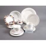 A bone china floral decorated teaset, a white relief decorated part dinner service and an