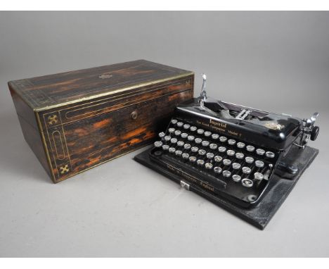 A 19th century rosewood and brass inlaid writing box for restoration, 16" wide, and an Imperial four-bank portable typewriter