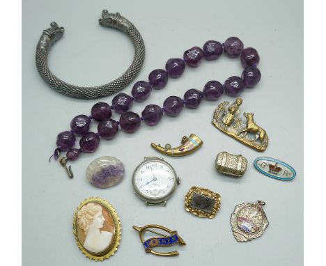 A cameo brooch, a cast brass girl and dog brooch, a Blue John brooch, a small Georgian/Victorian mourning brooch in gold colo