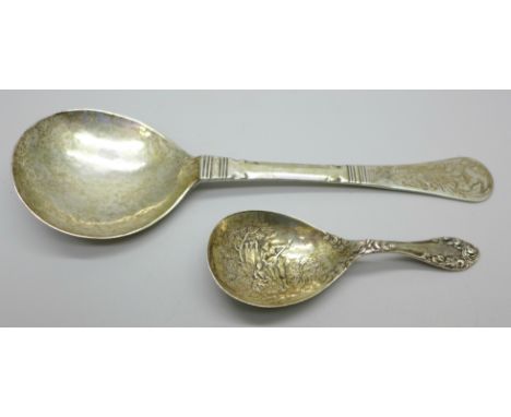 A late 19th Century silver caddy spoon with decorated bowl, Birmingham 1899, Levi &amp; Salaman, and a continental white meta