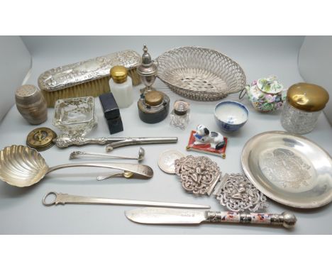 An Egyptian silver dish, a Victorian silver backed brush, a plated buckle, a plated ladle, a white metal mounted glass salt, 