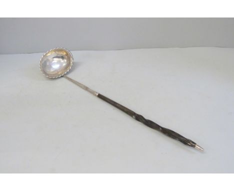 A Georgian silver toddy ladle, worn London hallmark 