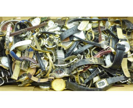 A large collection of vintage wristwatches and pocket watches, buttons and watch faces 