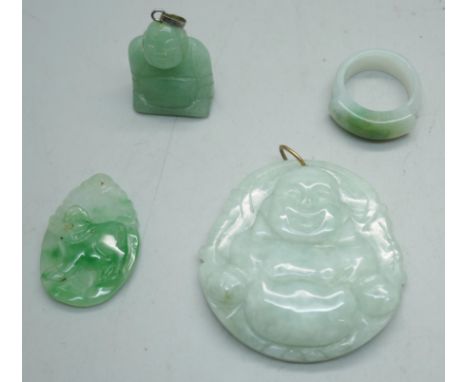 An ice green jade carved laughing Buddha pendant, a jade ring, a small carved jade ram pendant and a small jade Buddha pendan