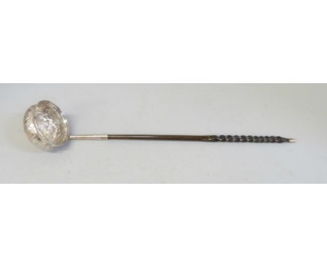 A toddy ladle with baleen handle, the bowl inset with a 1720's Brazilian 400 reis gold coin 