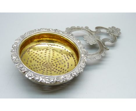 A George III Scottish silver lemon strainer with gilt interior, Edinburgh 1828, William Marshall, 156g, 11cm x 20.5cm 