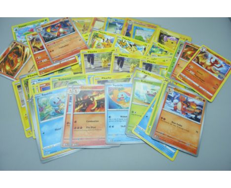 Sixty Pokemon cards including vintage cards Red Cheek Pikachu, Charmander, Squirtle, etc. 