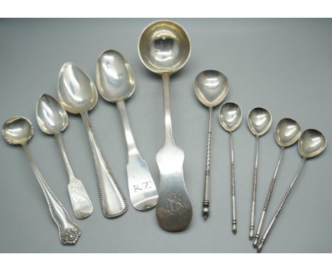 Nine spoons; ladle with continental control mark, two large spoons with continental control marks, a Russian silver spoon wit
