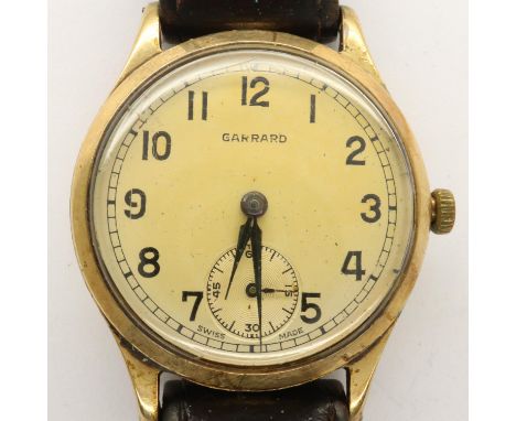GARRARD: gents 9ct gold cased wristwatch on a leather strap, working at lotting. UK P&amp;P Group 1 (£16+VAT for the first lo