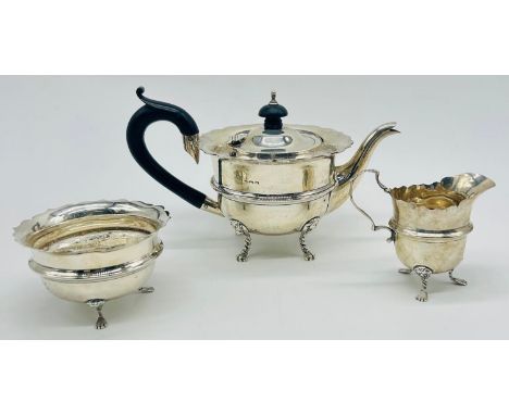 Silver teapot, sugar and cream jug, F H Adams Ltd, Birmingham 1911Weight - 344g(Cream jug not hallmarked)