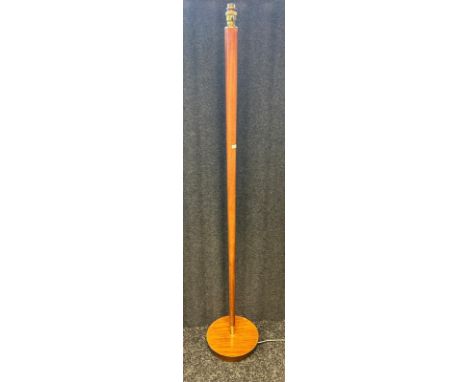 A mid-century teak free standing lamp