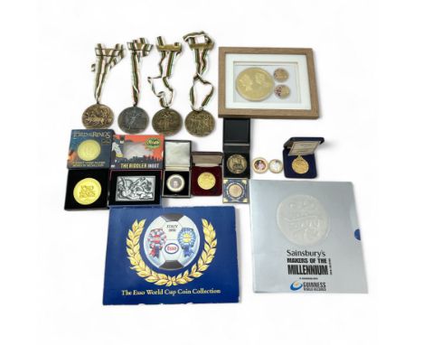 A range of medallions etc, to include The Esso World Cup Coin Collection 1990 in presentation folder, Makers of the Millenniu