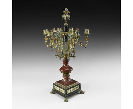 19th century AD. A substantial Art Deco brass candelabrum comprising: square base with claw foot and pad to each corner, thre