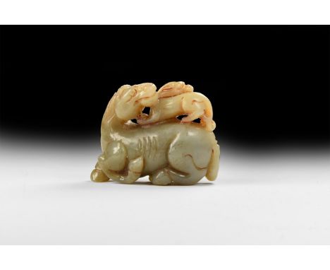 An undated archaistic faux-jade figurine of a regardant horse with pixiue on its back, modelled in the round.  139 grams, 68m