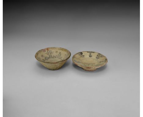 A pair of undated archaistic glazed ceramic bowls each with a band of calligraphic text to the inner face, one with polychrom
