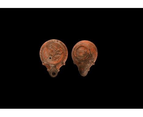 19th century AD. An antique or earlier Roman ceramic oil lamp in 1st-2nd century AD style with rounded nozzle, volute scroll 