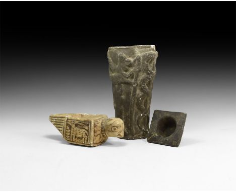 An undated archaistic group of carved stone items comprising an oil lamp with bird detailing and figural panels, an inkwell w