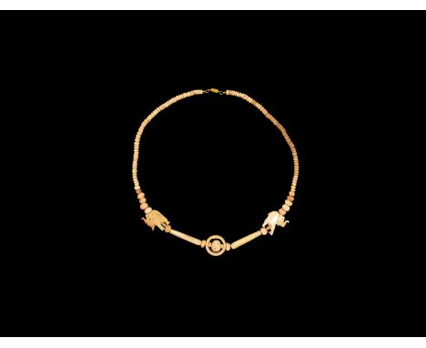 19th century AD. A restrung bone necklace consisting of numerous flat disc beads, cylinder beads and elongated tube beads wit