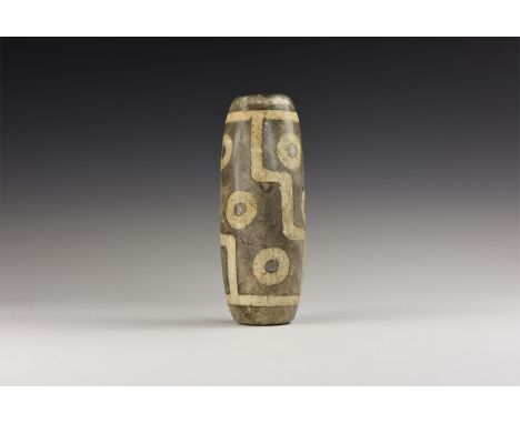 20th century AD. A large ceramic dzi bead with nine eyes, stepped segments.  398 grams, 12cm (4 3/4"). London private collect