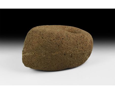 Neolithic Period, 6th-3rd millennium BC. A ground and pecked stone axe-hammer, boat-shaped in plan with straight edge, rounde