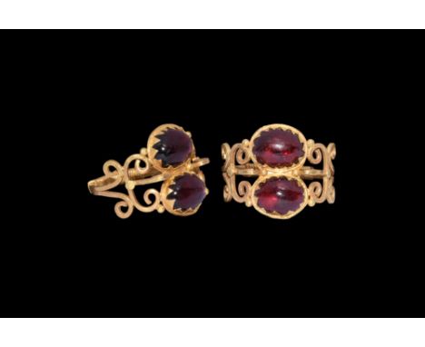 An undated archaistic gold ring in 1st century BC style comprising a hoop of two bands with filigree wound about the shank, s