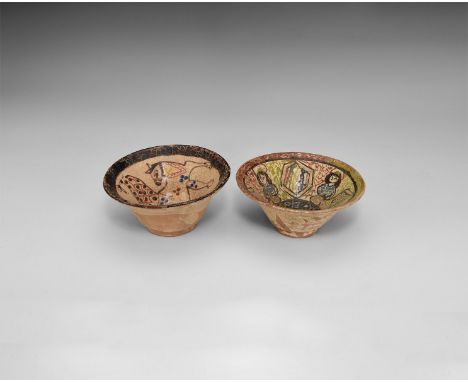 A group of two glazed ceramic bowls one with frieze of three seated figures around an inscribed circle; one with advancing re