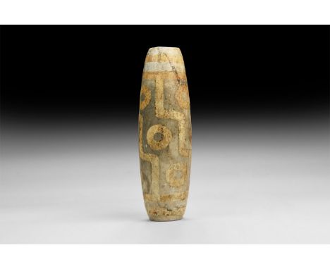 20th century AD. A ceramic dzi bead with nine annular eyes.  386 grams, 13cm (5"). Property of a London gentleman; acquired b