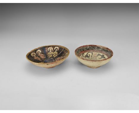 A group of two undated archaistic glazed ceramic bowls, one with curbed tendrils and foliage, the other with a pair of facing