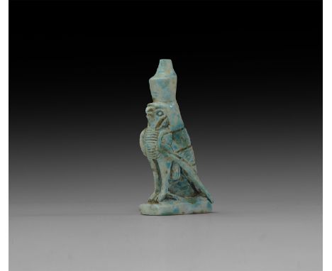 An undated archaistic pale blue glazed composition figure of Horus in falcon form in Third Intermediate Period, 1069-702 BC s