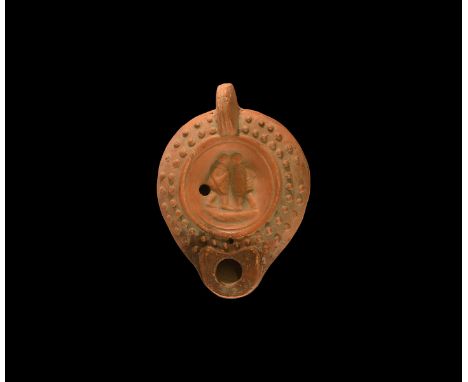 19th century AD. An antique or earlier Roman ceramic oil lamp in 3rd century AD style with short, round nozzle, lug handle to