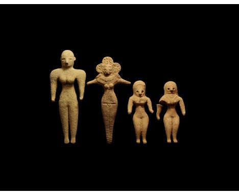 An undated archaistic group of ceramic figurines, recumbent females with headdresses and collars.  412 grams, 11.5-17.5cm (4 