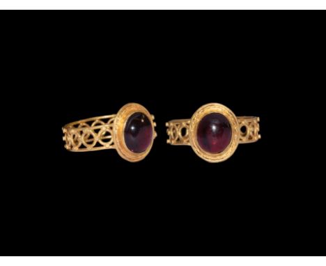 An undated archaistic gold ring in 1st century BC-1st century AD style comprising a hoop of two bands joined by annulets with