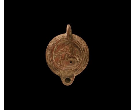 19th century AD. An antique or earlier Roman ceramic oil lamp in 2nd century AD style with short rounded nozzle, ring handle 