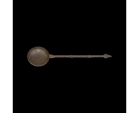 19th century AD. A bronze ladle with shallow circular bowl, square-section shank with collars, leaf-shaped hook finial; ring-