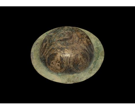 An undated archaistic spun bronze bowl with rosette and ring-and-dot motifs to the inner face, profile busts in hatched round