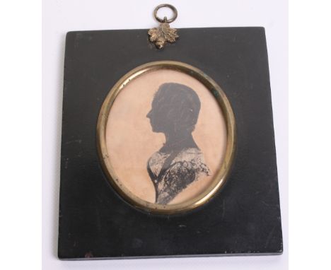 19th Century Miniature Silhouette Portrait of a Lady housed in an ebonised frame with gilt metal acorn ring mounting to the t
