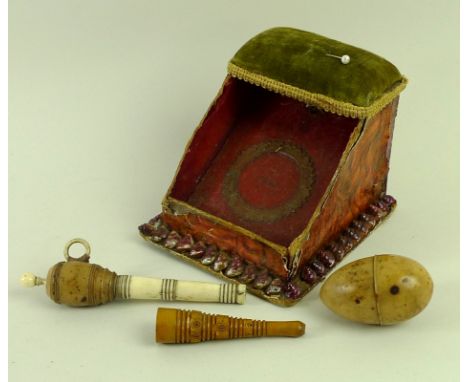 A late Victorian sewing set, comprising a horn sewing egg stained to resemble a chaffinch egg, with hollow interior for a bob