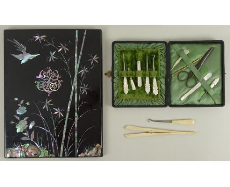 A Japanese mother of pearl and abalone shell inlaid blotter covers, decorated with a custom made monogram EB, birds, bamboo a